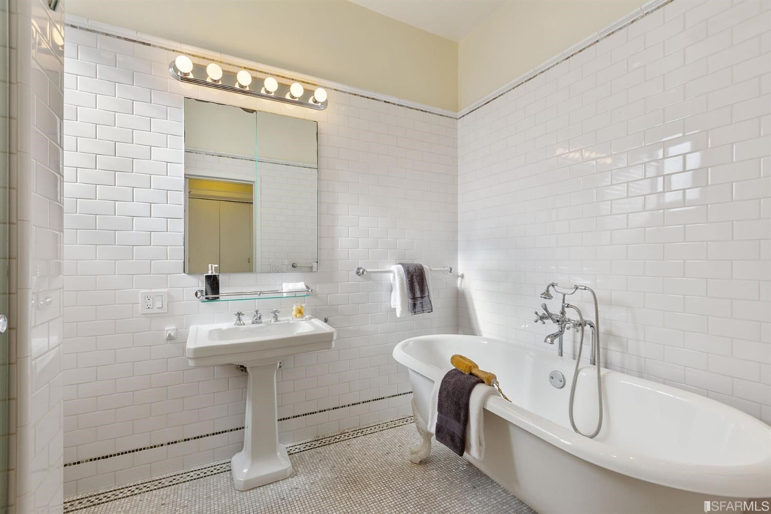 2526 Union Street San Francisco, CA 94123 - Photo 51 of 78 a bathroom with a sink a bathtub and a mirror