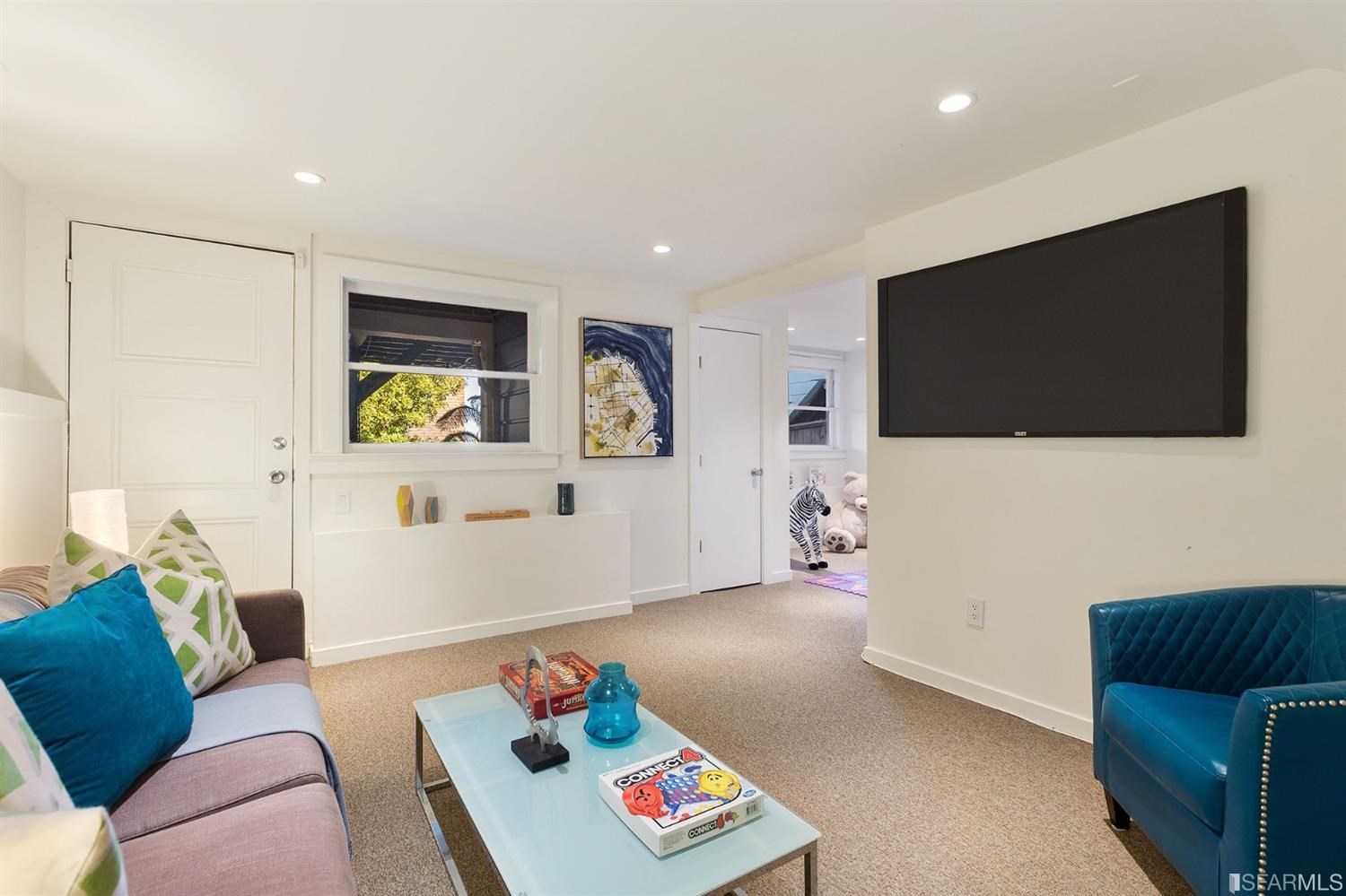 2526 Union Street San Francisco, CA 94123 - Photo 54 of 78 a living room with furniture and a flat screen tv