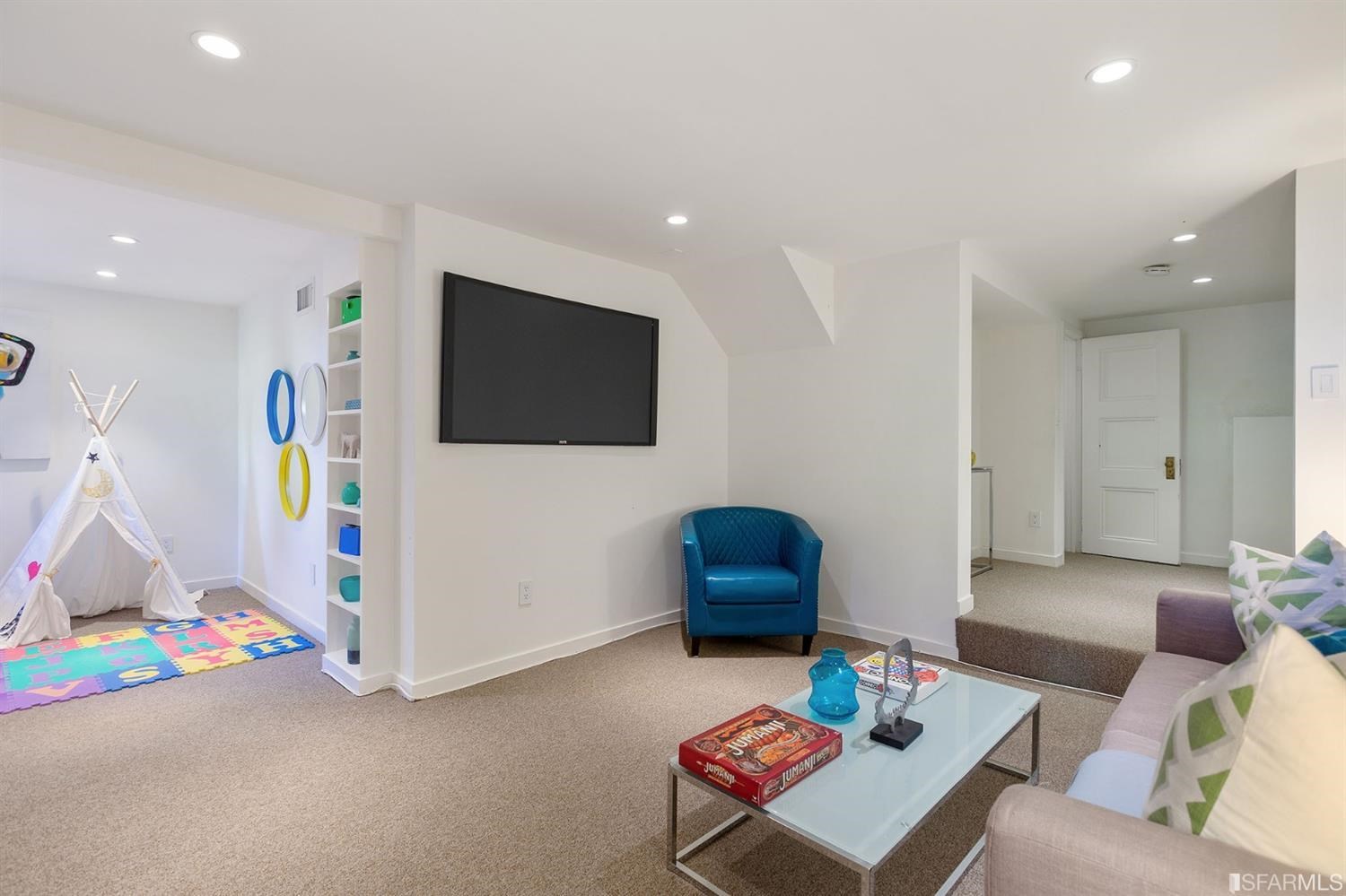 2526 Union Street San Francisco, CA 94123 - Photo 55 of 78 a living room with furniture and a flat screen tv