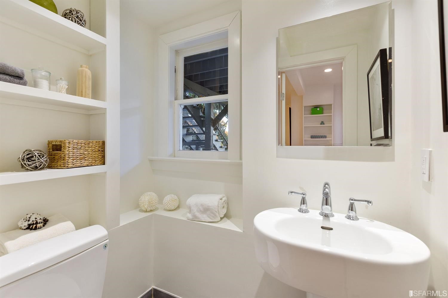 2526 Union Street San Francisco, CA 94123 - Photo 58 of 78 a bathroom with a sink and a mirror