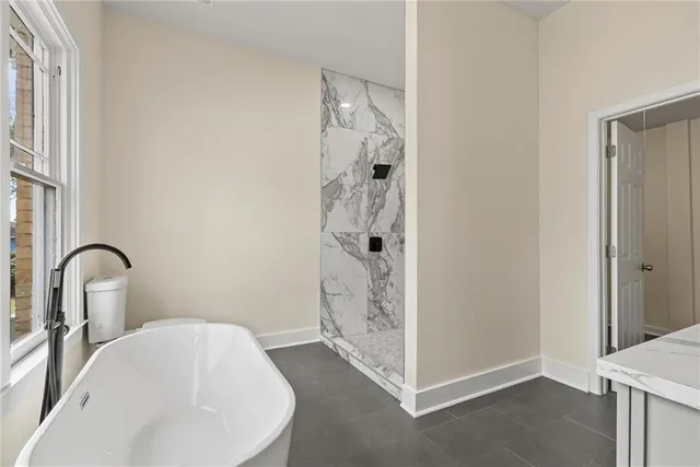 a bathroom with a sink and shower