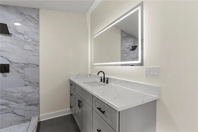 a bathroom with a sink and a mirror