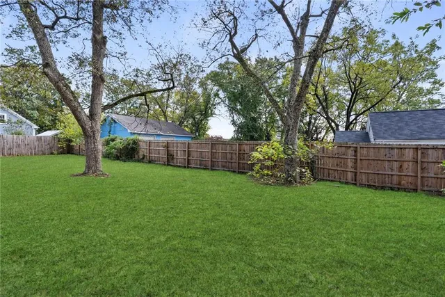 a view of a backyard with green space