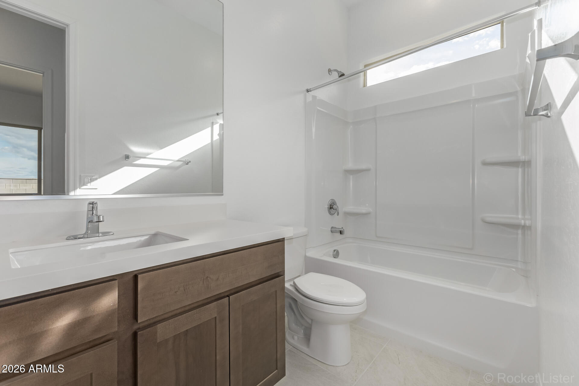 17408 West Via Dona Road Surprise, AZ 85387 - Photo 13 of 17 a bathroom with a sink a toilet and a bathtub