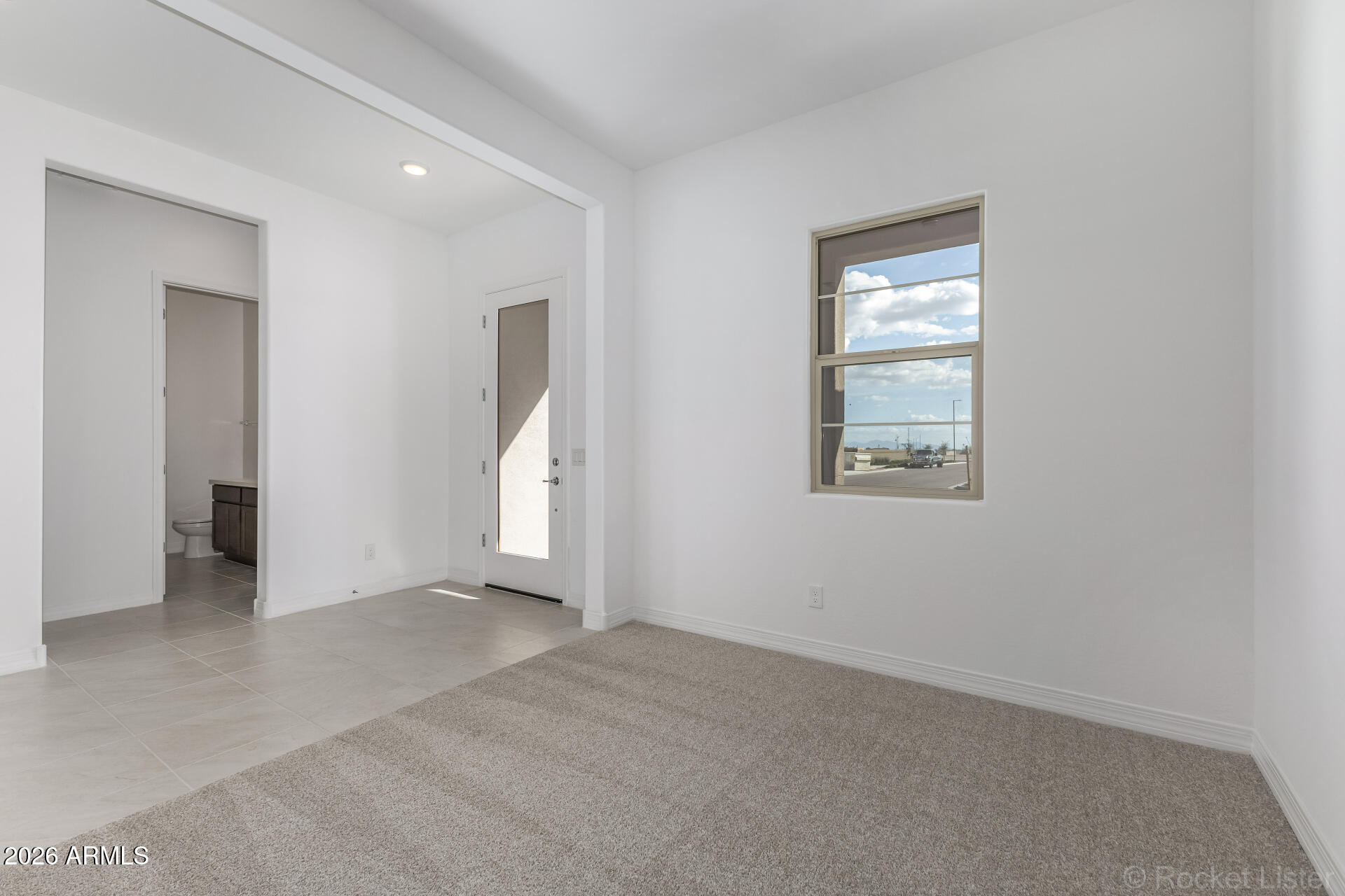 17408 West Via Dona Road Surprise, AZ 85387 - Photo 2 of 17 an empty room with windows and closet