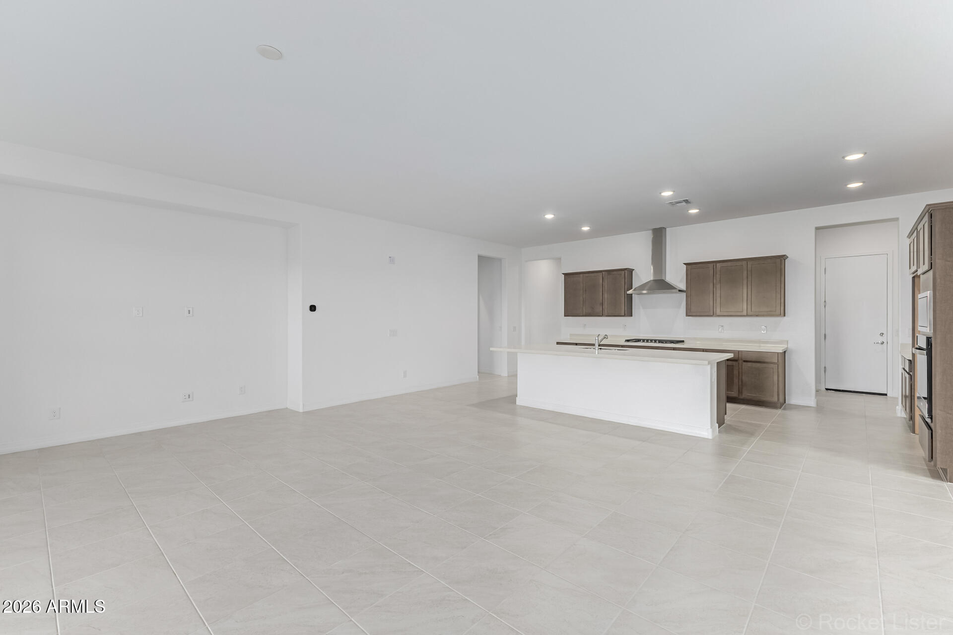 17408 West Via Dona Road Surprise, AZ 85387 - Photo 6 of 17 a view of kitchen with kitchen island white cabinets and stainless steel appliances