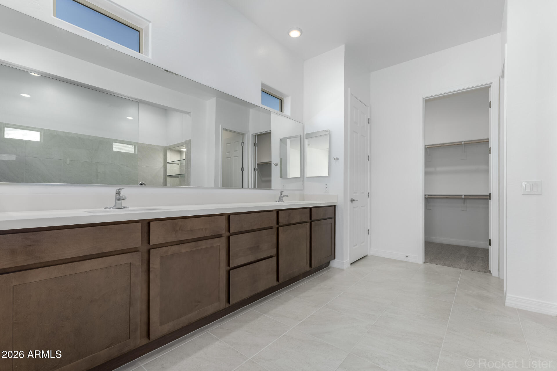 17408 West Via Dona Road Surprise, AZ 85387 - Photo 10 of 17 a spacious bathroom with a granite countertop sink mirror and cabinets