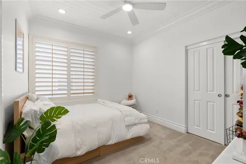 a bed room with a bed and a window