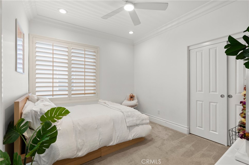 6572 Beachview Drive Huntington Beach, CA 92648 - Photo 13 of 17 a bed room with a bed and a window