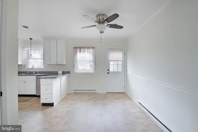 a view of a kitchen with electric appliances