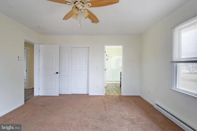 a bathroom with a granite countertop sink mirror and double