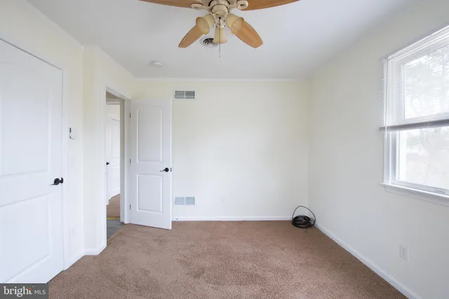 a bathroom with a double vanity sink mirror and shower