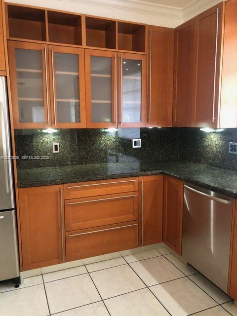 9910 Southwest 23rd Street Miami, FL 33165 - Photo 11 of 39 a kitchen with granite countertop wooden cabinets and a sink
