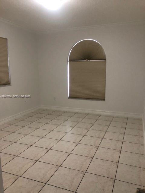 9910 Southwest 23rd Street Miami, FL 33165 - Photo 17 of 39 a room with a sink and a vanity