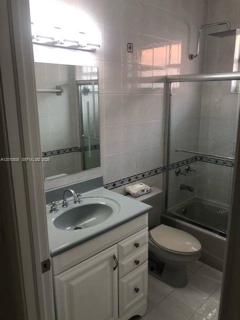 9910 Southwest 23rd Street Miami, FL 33165 - Photo 19 of 39 a bathroom with a sink toilet and shower