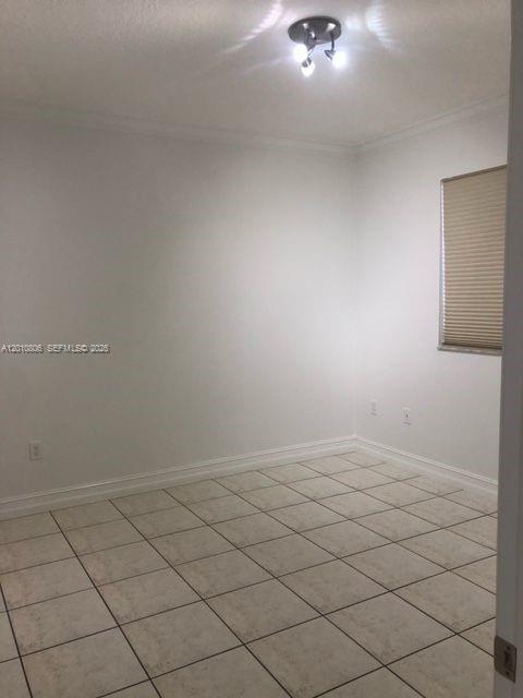 9910 Southwest 23rd Street Miami, FL 33165 - Photo 21 of 39 a view of an empty room
