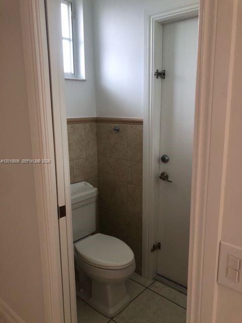 9910 Southwest 23rd Street Miami, FL 33165 - Photo 31 of 39 a bathroom with a toilet and a shower