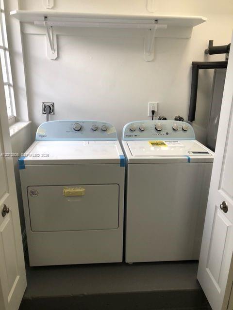 9910 Southwest 23rd Street Miami, FL 33165 - Photo 35 of 39 a utility room with dryer and washer