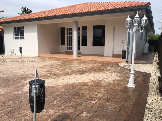 9910 Southwest 23rd Street Miami, FL 33165 - Photo 36 of 39 a backyard of a house
