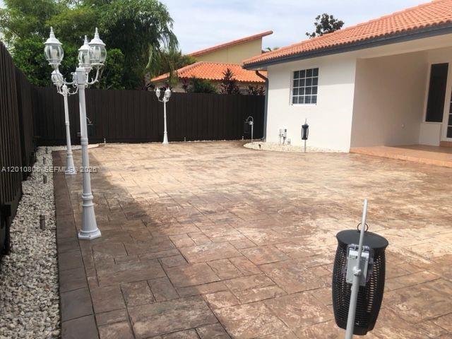 9910 Southwest 23rd Street Miami, FL 33165 - Photo 37 of 39 a view of a house with backyard