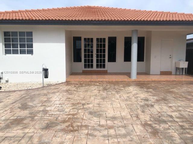 9910 Southwest 23rd Street Miami, FL 33165 - Photo 38 of 39 a view of a house with backyard