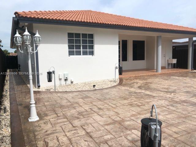 9910 Southwest 23rd Street Miami, FL 33165 - Photo 39 of 39 a view of a house with backyard