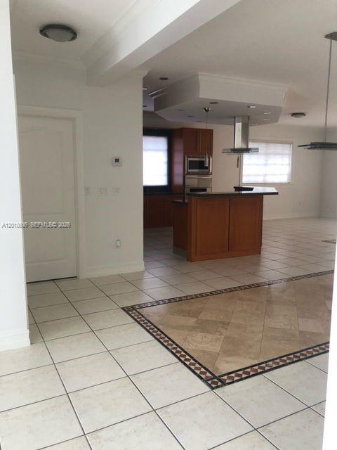 9910 Southwest 23rd Street Miami, FL 33165 - Photo 5 of 39 a view of kitchen with cabinets