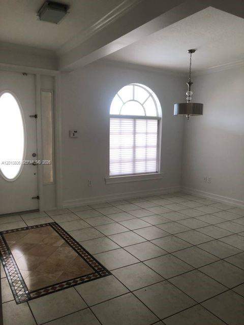 9910 Southwest 23rd Street Miami, FL 33165 - Photo 6 of 39 an empty room with windows