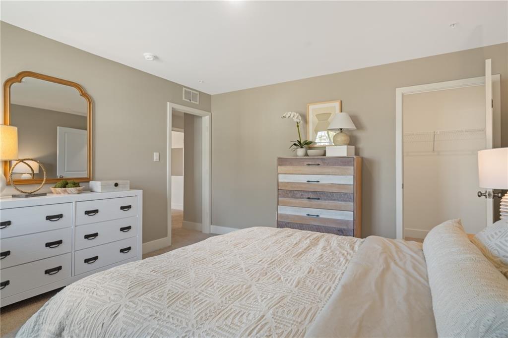 1020 Lindsay Road Carnegie, PA 15106 - Photo 20 of 32 a bedroom with a bed and mirror
