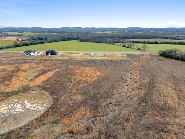 a view of lake with mountain in the background