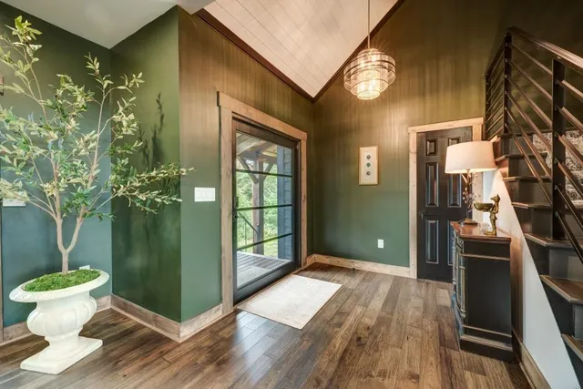 a living room with furniture tv and a large window