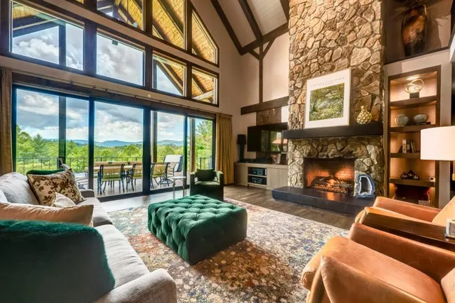 a living room with furniture and a ceiling fan