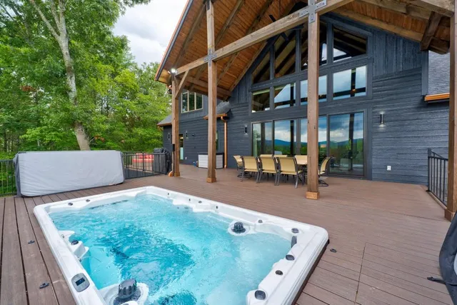 a bathroom with a glass shower door and a sink