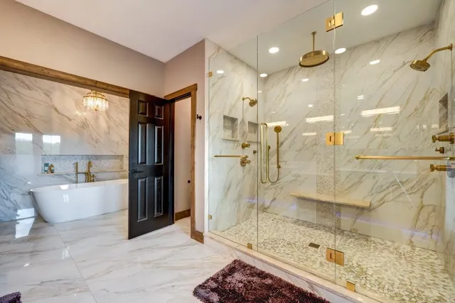 a bedroom with a bed ceiling fan and a window