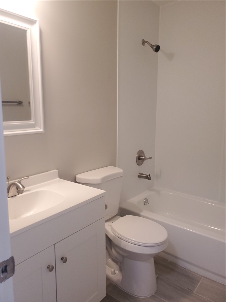 3300 South 7th Street, Unit B Fort Pierce, FL 34982 - Photo 14 of 32 a bathroom with a sink a toilet and shower
