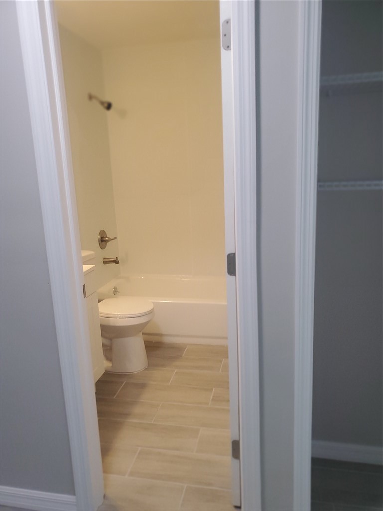 3300 South 7th Street, Unit B Fort Pierce, FL 34982 - Photo 15 of 32 a bathroom with a toilet and a shower