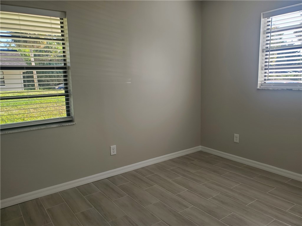 3300 South 7th Street, Unit B Fort Pierce, FL 34982 - Photo 19 of 32 a view of a room that has a window in it