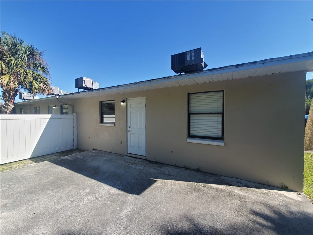 3300 South 7th Street, Unit B Fort Pierce, FL 34982 - Photo 30 of 32 a view of a big room with a ceiling fan