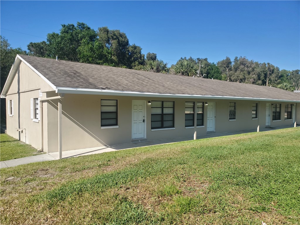 3300 South 7th Street, Unit B Fort Pierce, FL 34982 - Photo 31 of 32 a view of a house with a yard