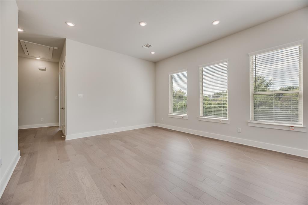 920 Ash Road Plano, TX 75075 - Photo 17 of 27 an empty room with wooden floor and windows