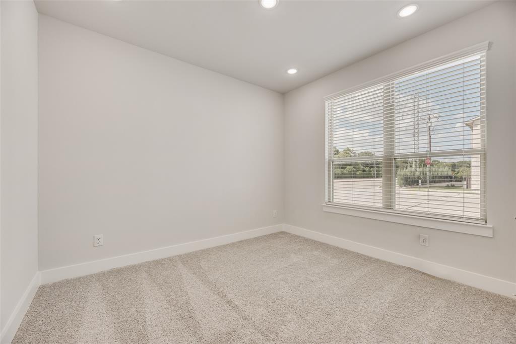 920 Ash Road Plano, TX 75075 - Photo 22 of 27 an empty room with a window