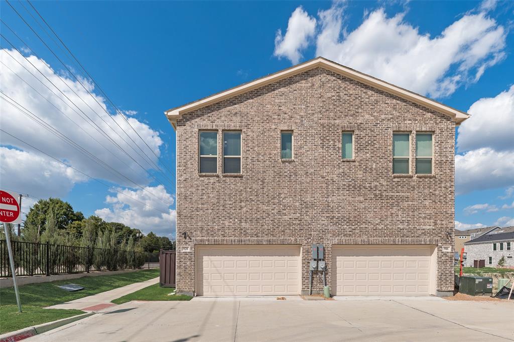 920 Ash Road Plano, TX 75075 - Photo 26 of 27 a front view of a house with a yard