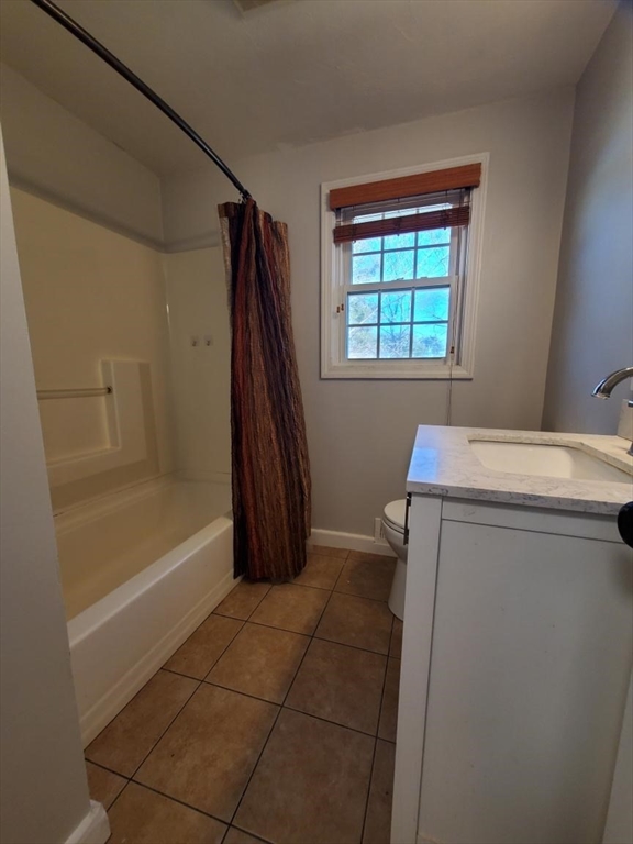 27 Upton Street Brockton, MA 02302 - Photo 11 of 24 a bathroom with a tub sink and a window