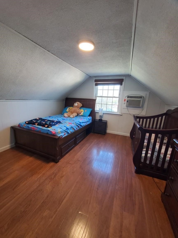 27 Upton Street Brockton, MA 02302 - Photo 16 of 24 a bedroom with furniture and a wooden floor
