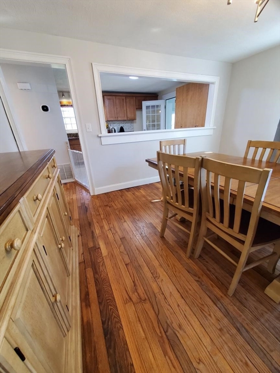 27 Upton Street Brockton, MA 02302 - Photo 9 of 24 a view of a livingroom with furniture and wooden floor