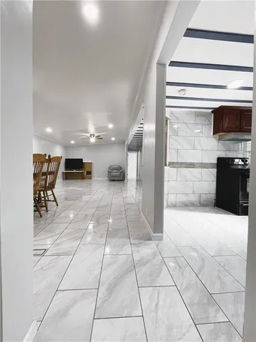 a kitchen with a sink appliances and cabinets