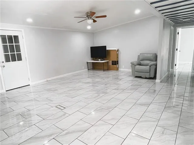 a kitchen with stainless steel appliances granite countertop a refrigerator and a stove