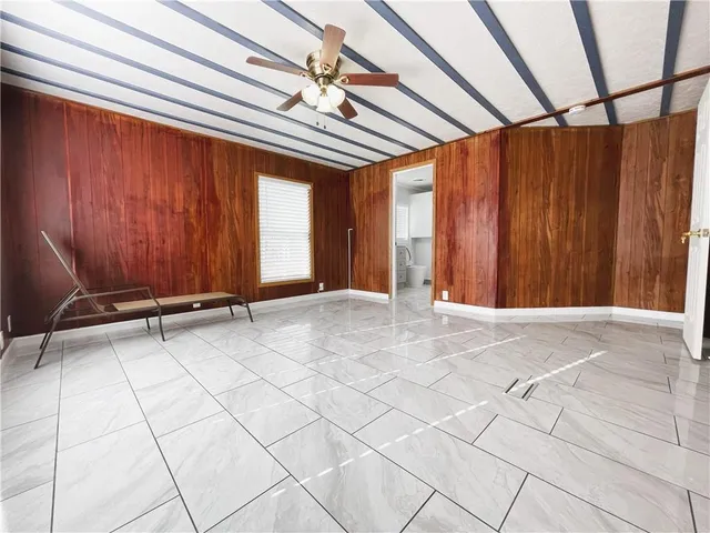 a spacious bathroom with a sink toilet and mirror