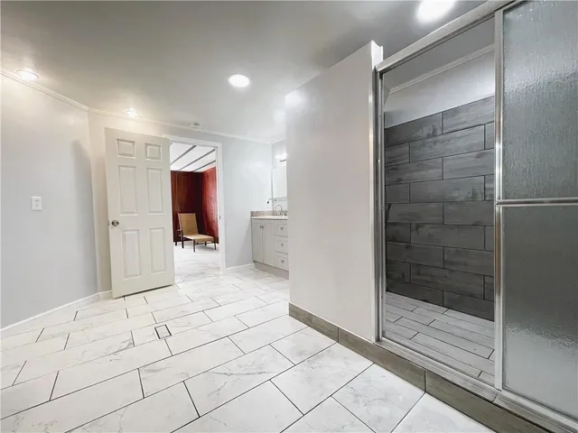 a view of an empty room with a window