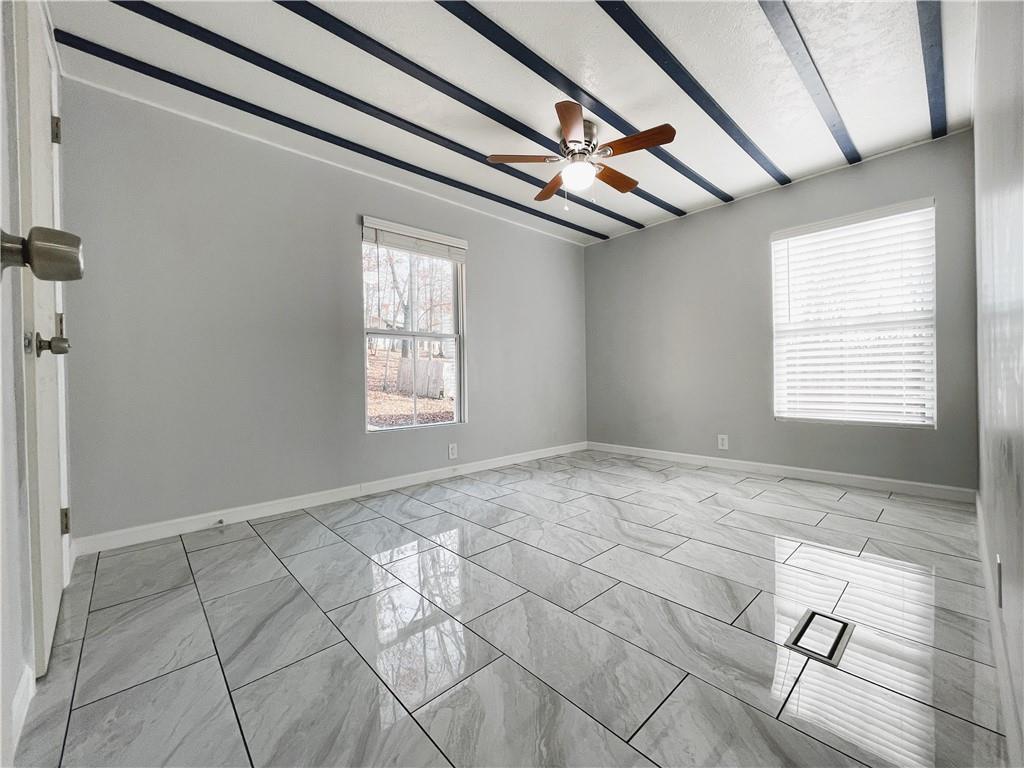 6225 Lollis Creek Road Flowery Branch, GA 30542 - Photo 21 of 36 a view of an empty room with a window